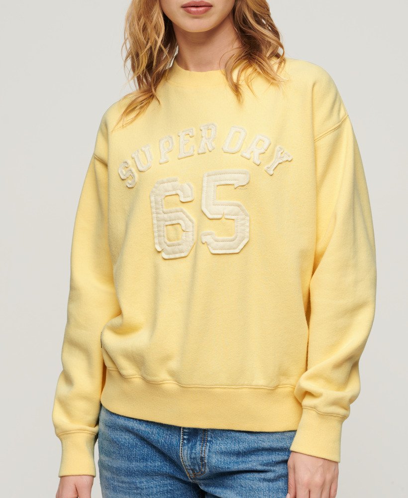 moletom esportivo folgado com apliques em amarelo claro