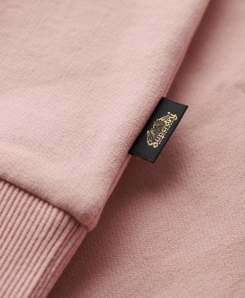moletom com capuz e logo retrô com glitter em rosa blush vintage