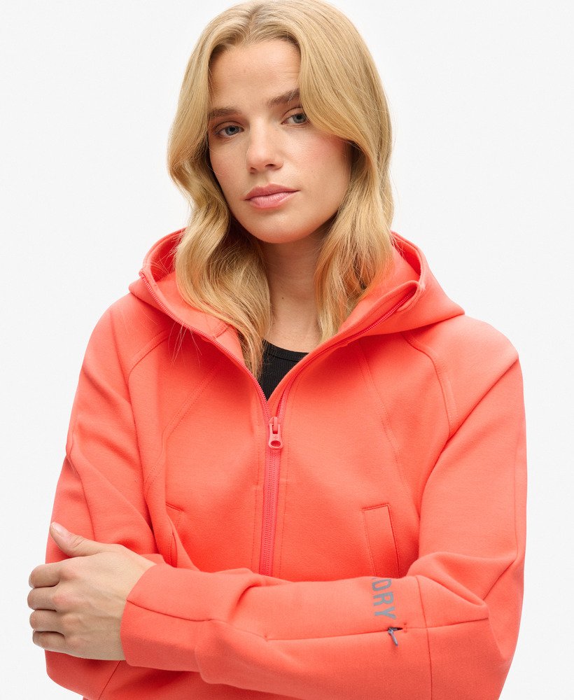 moletom com zíper sport tech relaxed na cor coral vibrante