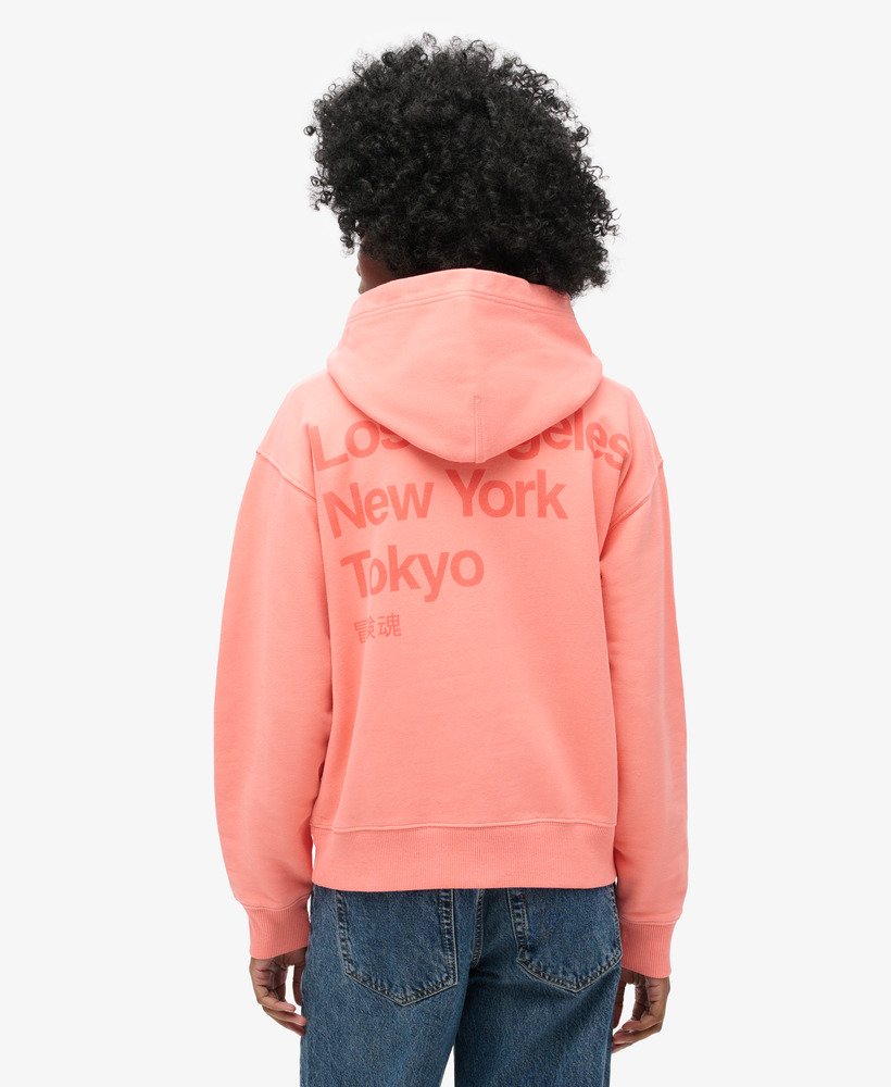 moletom folgado com capuz core logo city na cor coral pastel.