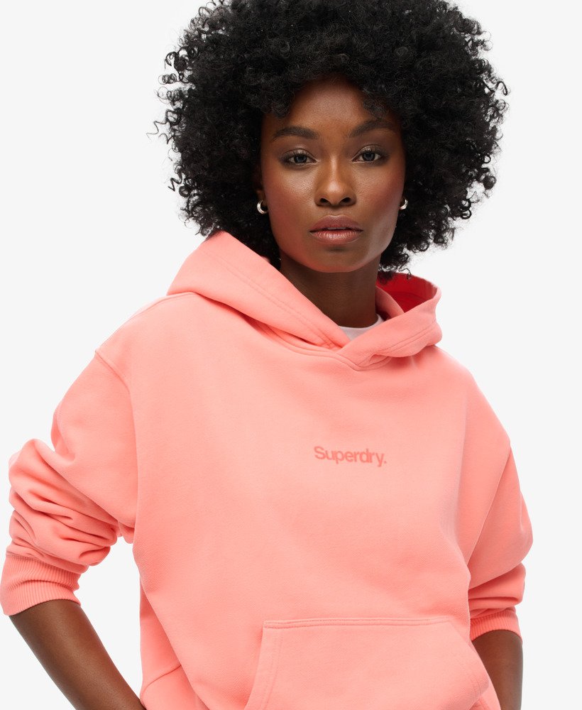 moletom folgado com capuz core logo city na cor coral pastel.