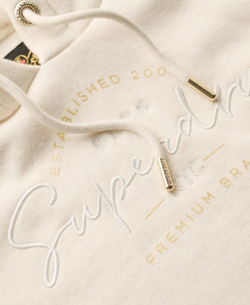 moletom com capuz luxuous metallic logo na cor oat cream mescl