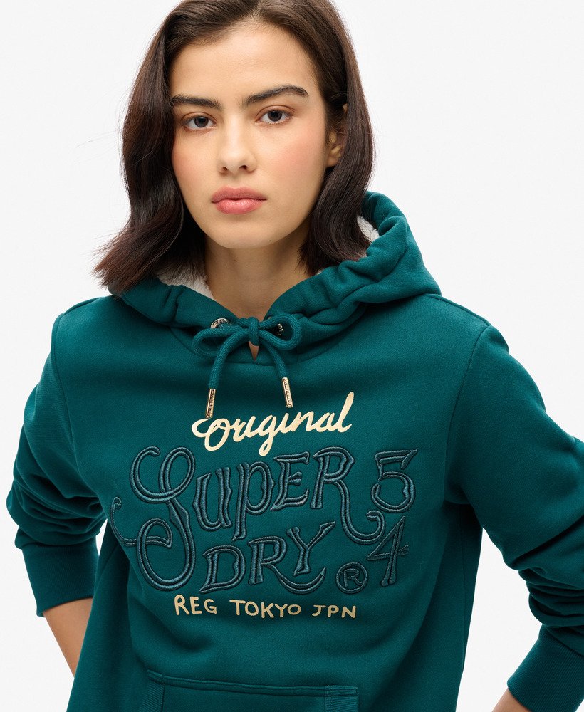 moletom com capuz luxe metallic logo na cor verde-azulado escuro.
