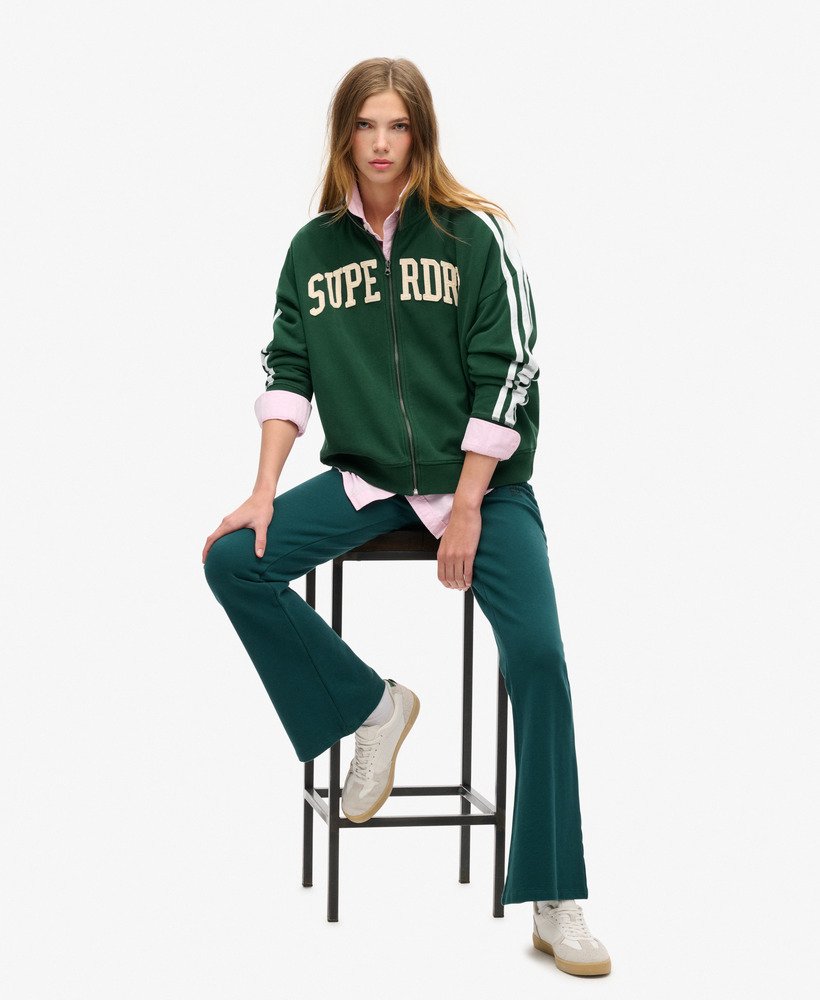jaqueta esportiva folgada com zíper e apliques da athletic essentials na cor verde esmalte.