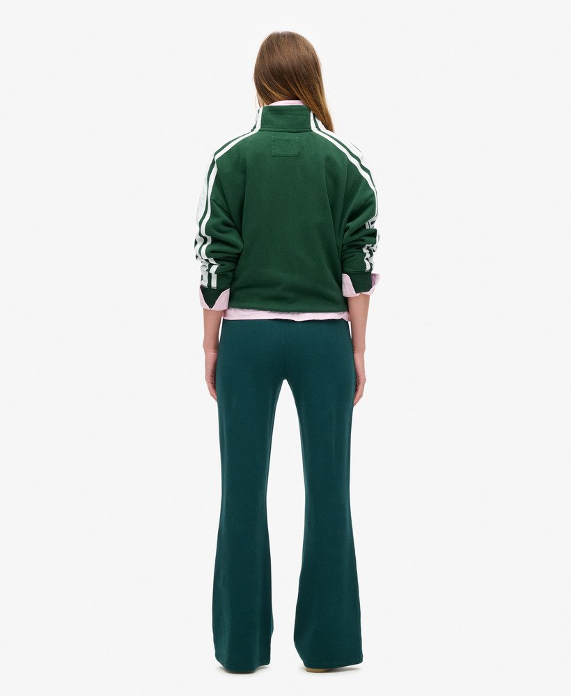 jaqueta esportiva folgada com zíper e apliques da athletic essentials na cor verde esmalte.