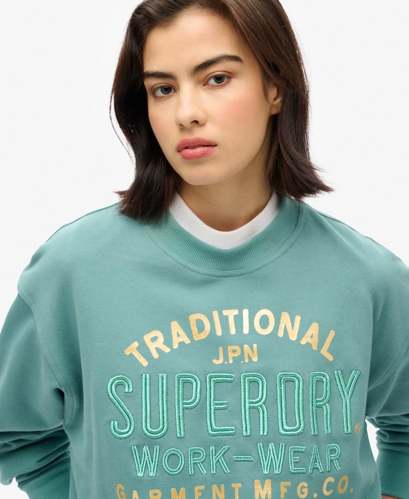 moletom folgado luxe metallic em verde-azulado.