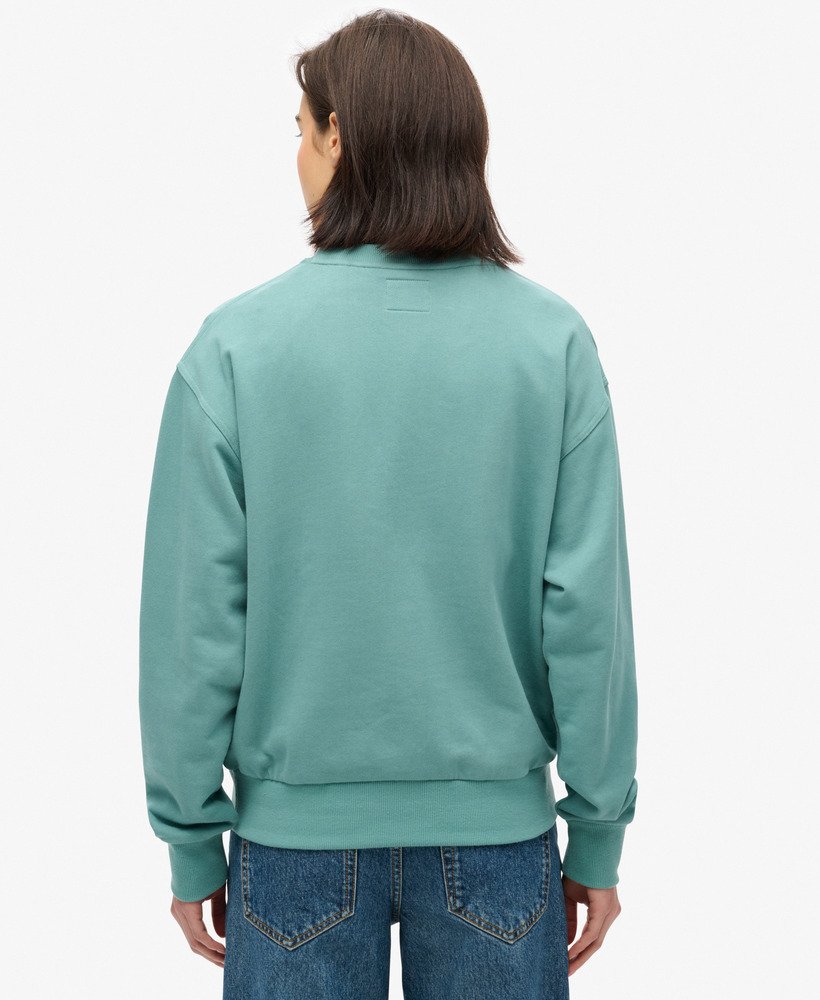 moletom folgado luxe metallic em verde-azulado.