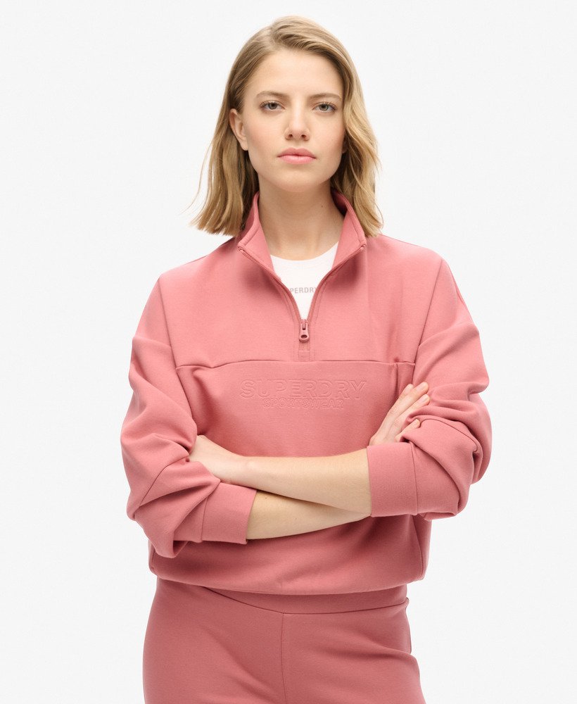 moletom sport tech relaxed com meio zíper na cor rosa murcha