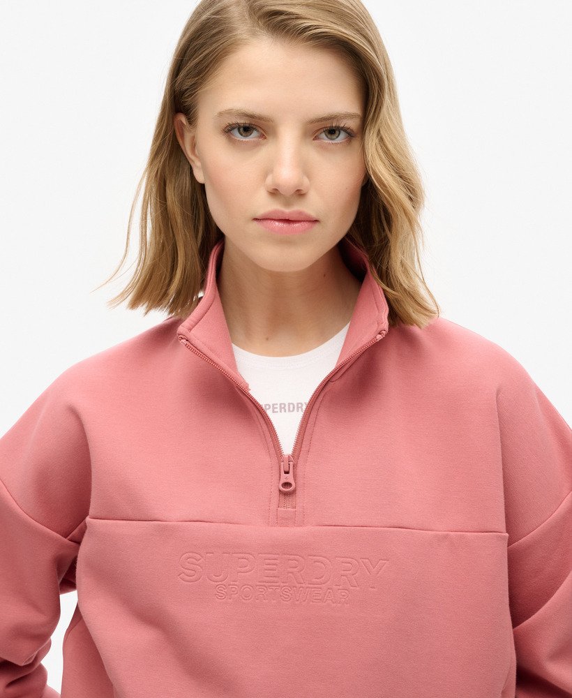 moletom sport tech relaxed com meio zíper na cor rosa murcha