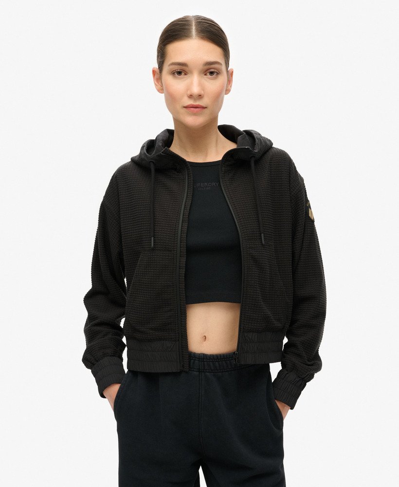 casaco com capuz e zíper sport tech grid fleece na cor preta.