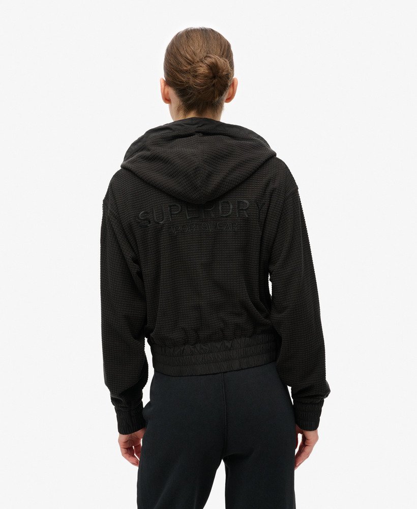 casaco com capuz e zíper sport tech grid fleece na cor preta.