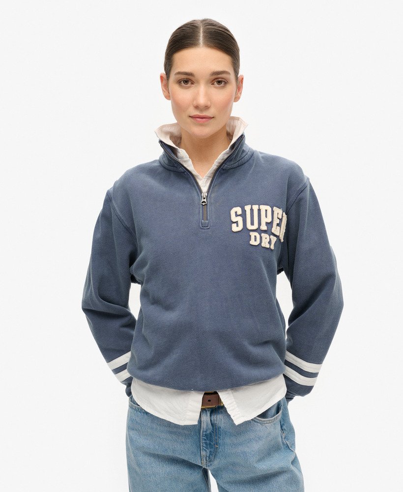 moletom athletic essentials com meio zíper e apliques na cor azul marinho.