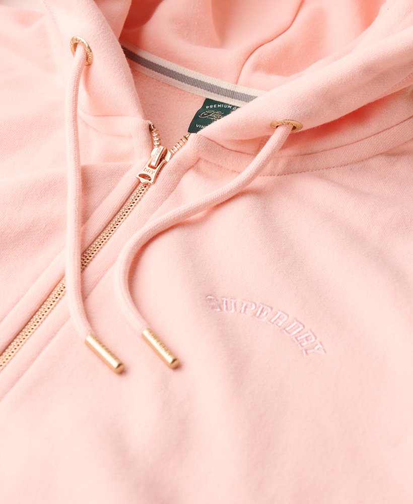 moletom com zíper e logo essencial na cor rosa claro
