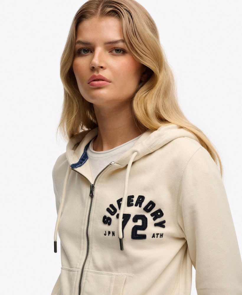 Moletom cropped com zíper, estilo esportivo e descontraído.