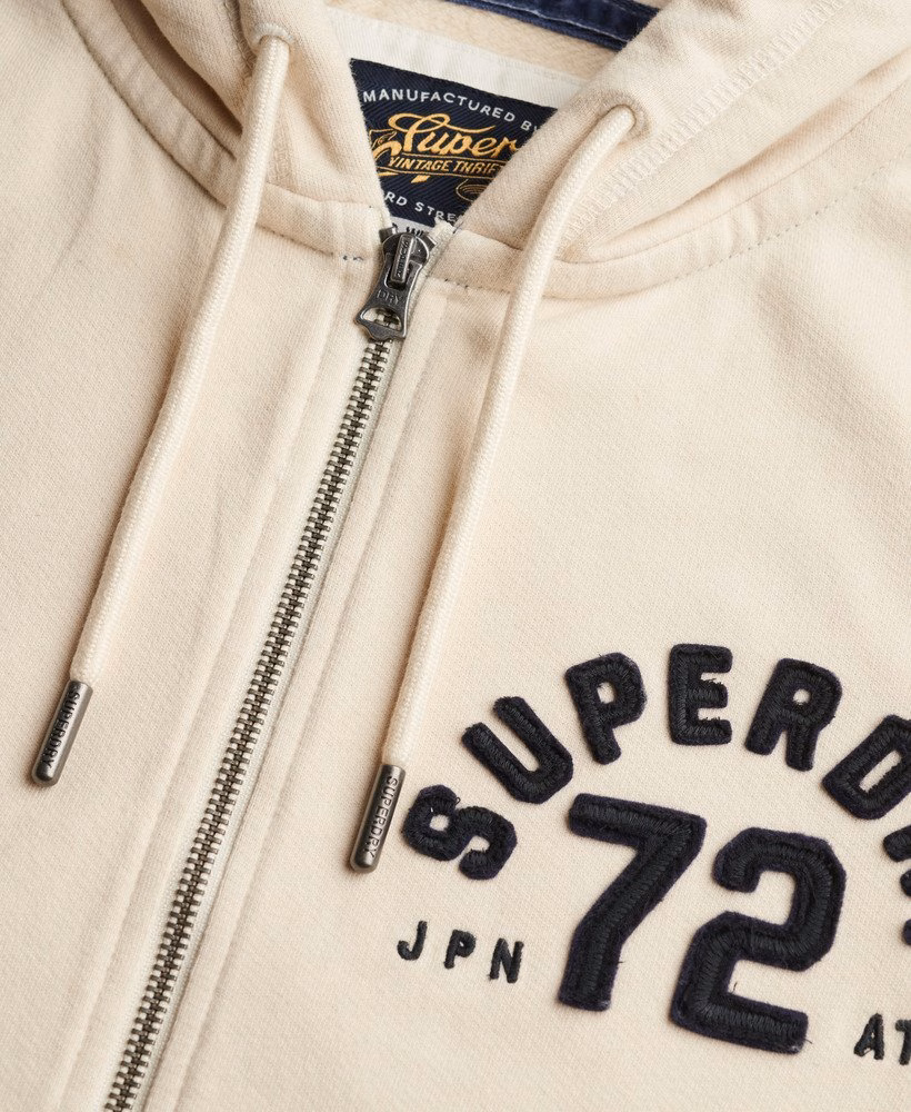 Moletom cropped com zíper, estilo esportivo e descontraído.