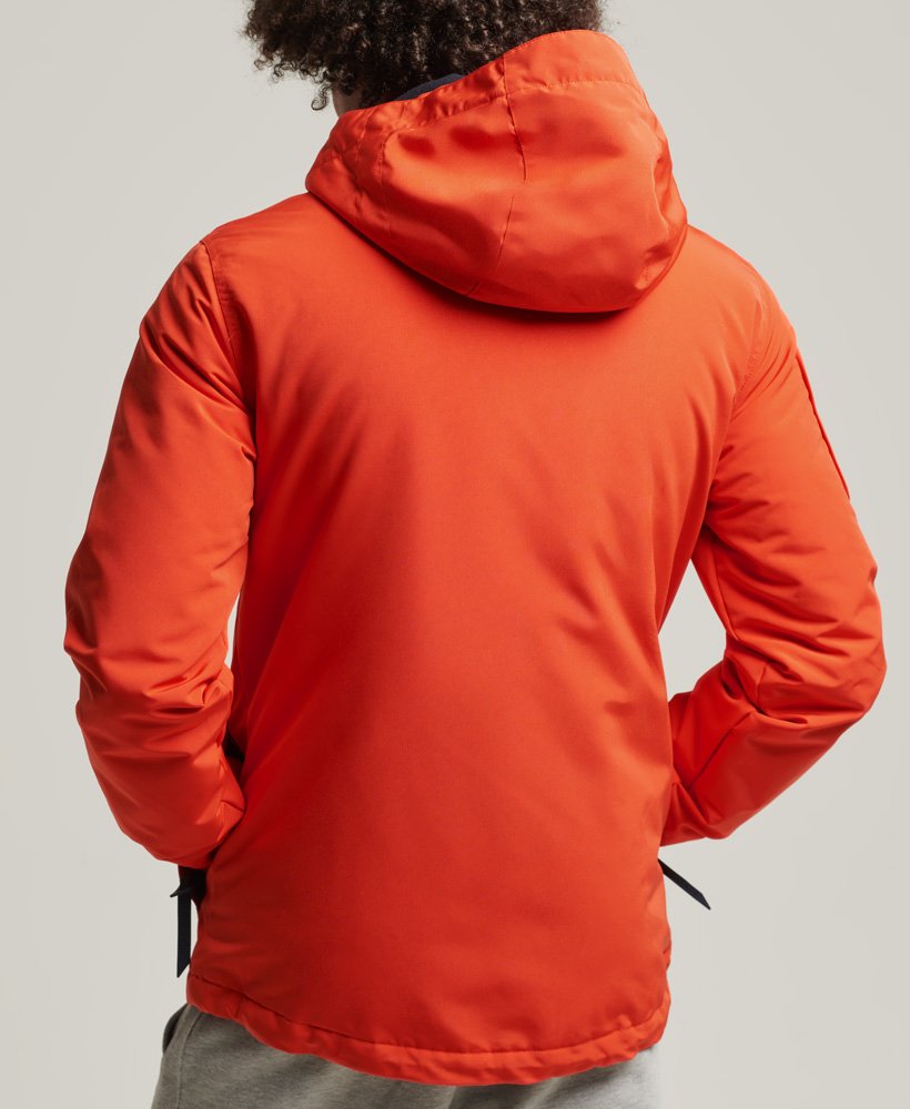 jaqueta corta-vento ultimate sd em laranja vibranteazul marinho intenso