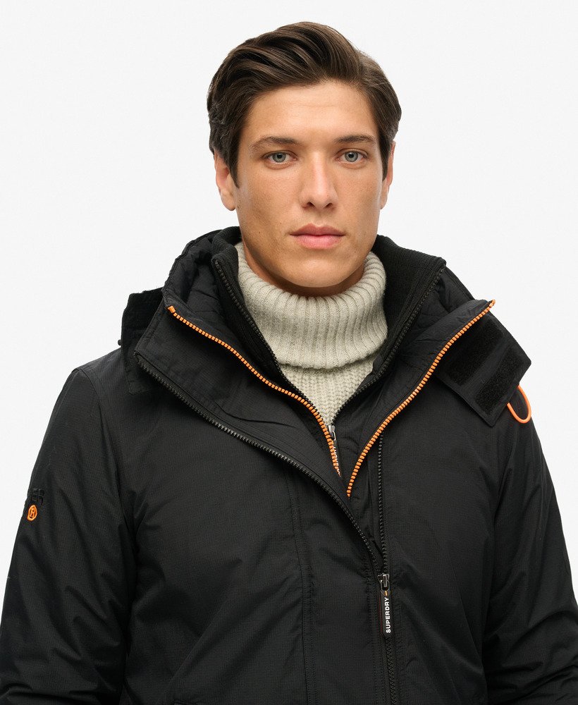 jaqueta corta-vento arctic sd com capuz e zíper frontal na cor pretolaranja fluorescente