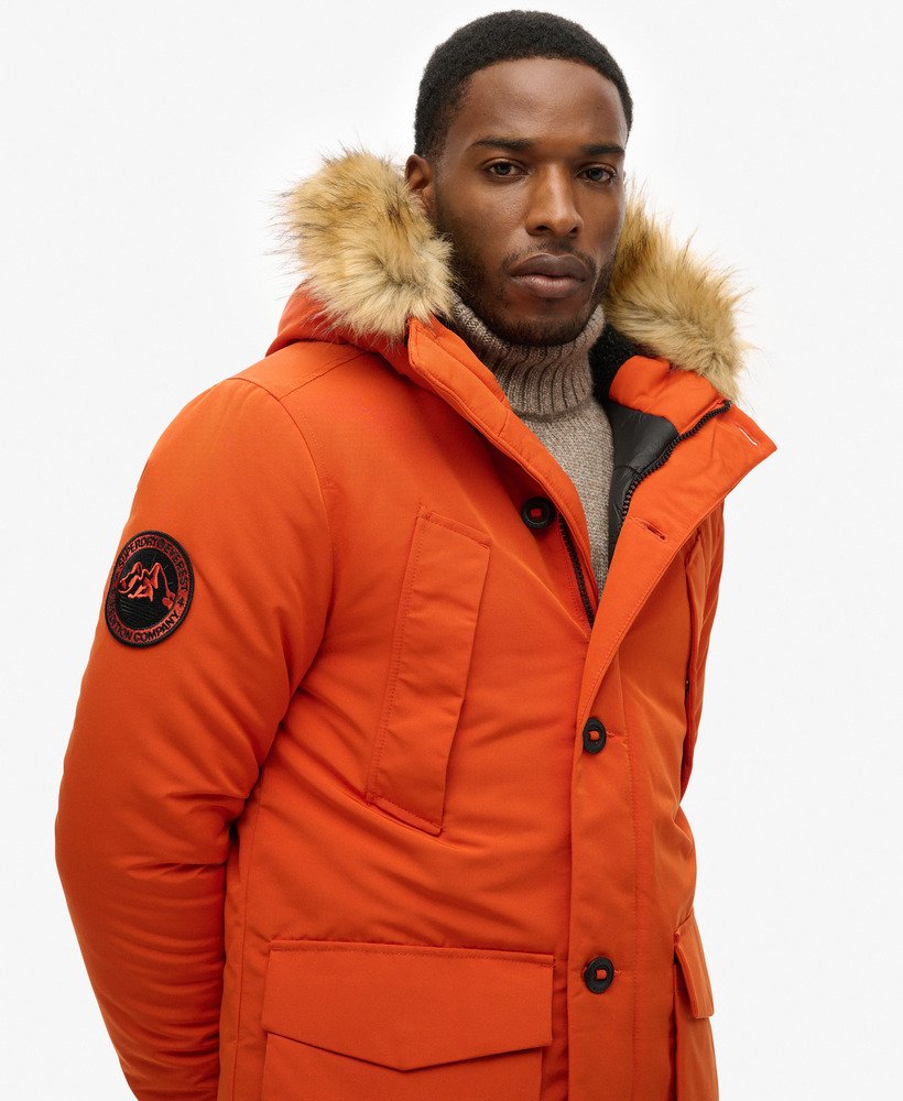 parka com capuz everest em pele sintética cor abóbora.