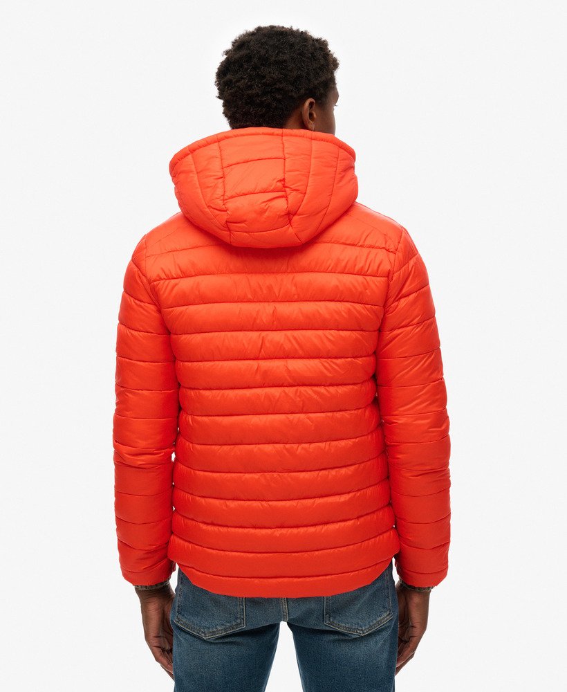 jaqueta acolchoada com capuz fuji sport na cor laranja vibrante.