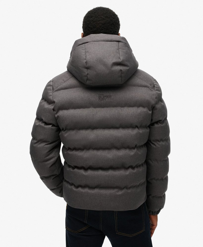 jaqueta esportiva puffer com capuz em tweed cinza mesclado.