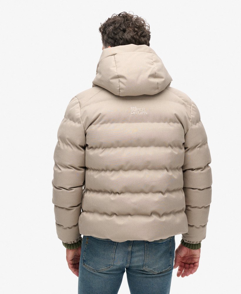 jaqueta esportiva puffer com capuz em tweed bege mesclado