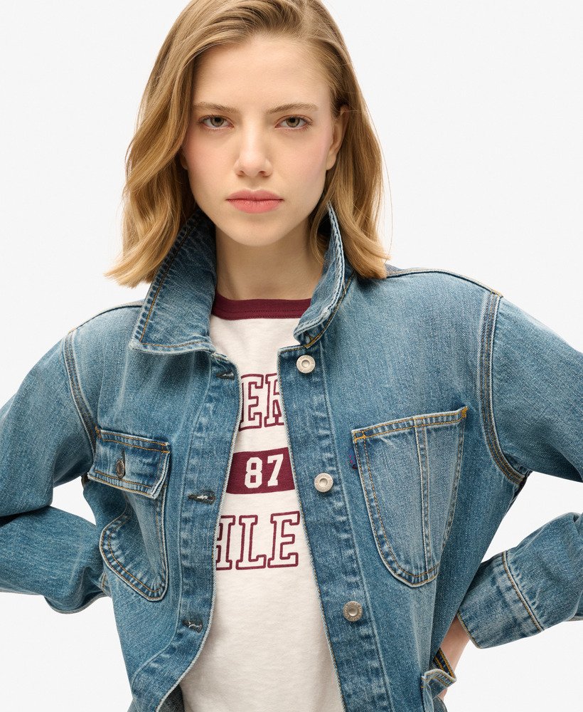 jaqueta utilitária em denim bordado na cor azul vintage fulton