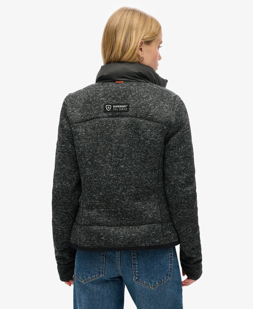 jaqueta híbrida storm knit na cor preta.