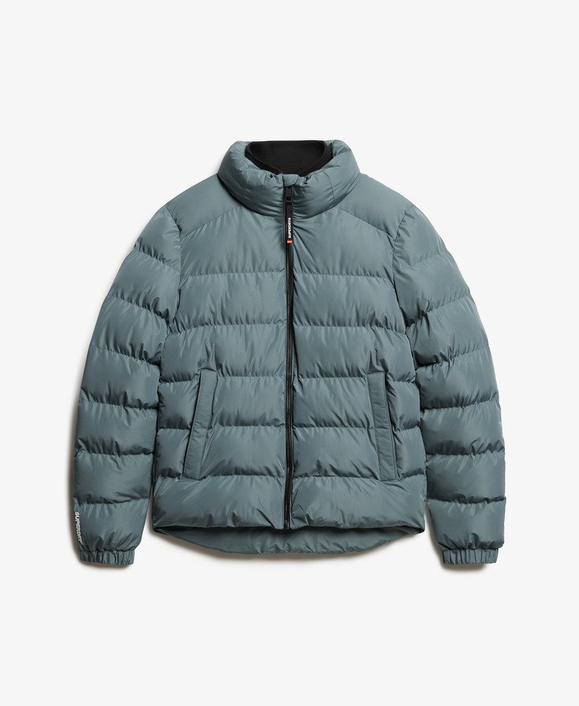 jaqueta puffer esportiva oversized na cor azul tempestade.
