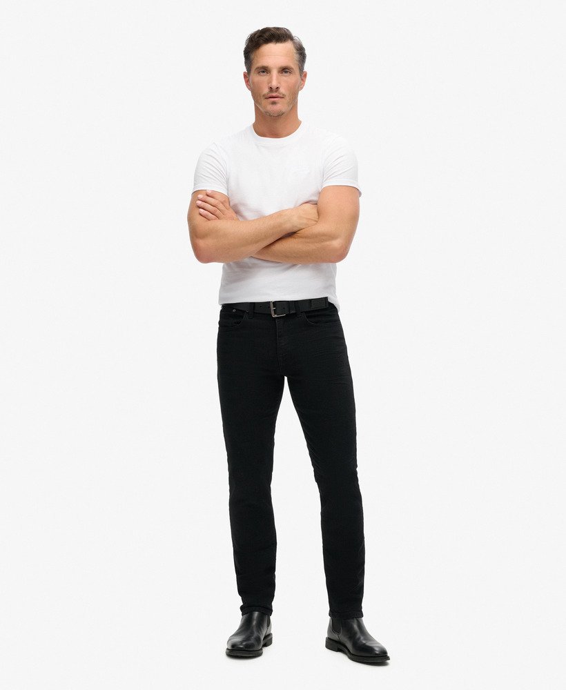 calça jeans vintage slim reta na cor preta lavada venom.