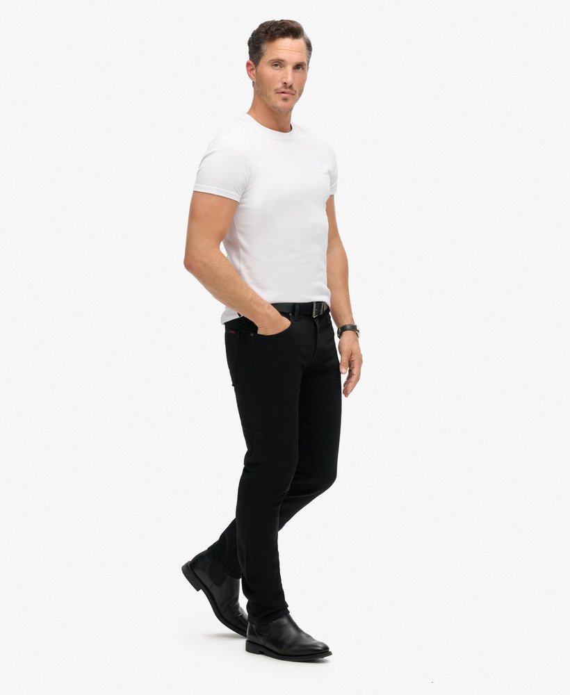 calça jeans vintage slim reta na cor preta lavada venom.