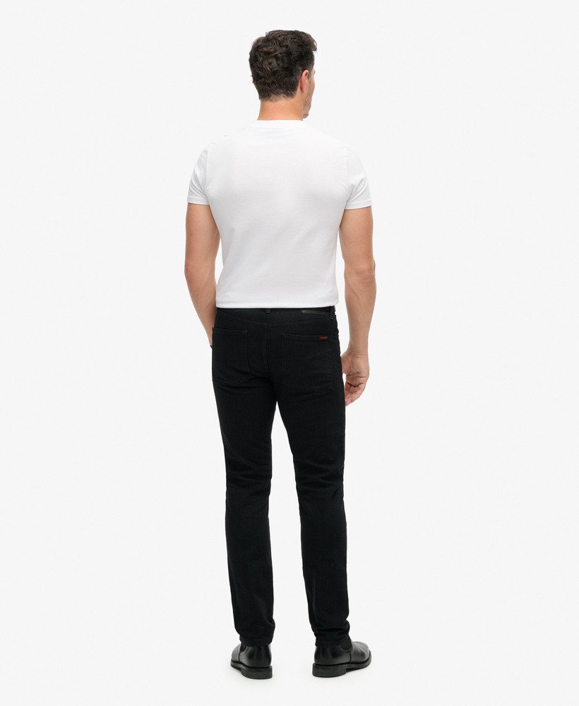 calça jeans vintage slim reta na cor preta lavada venom.