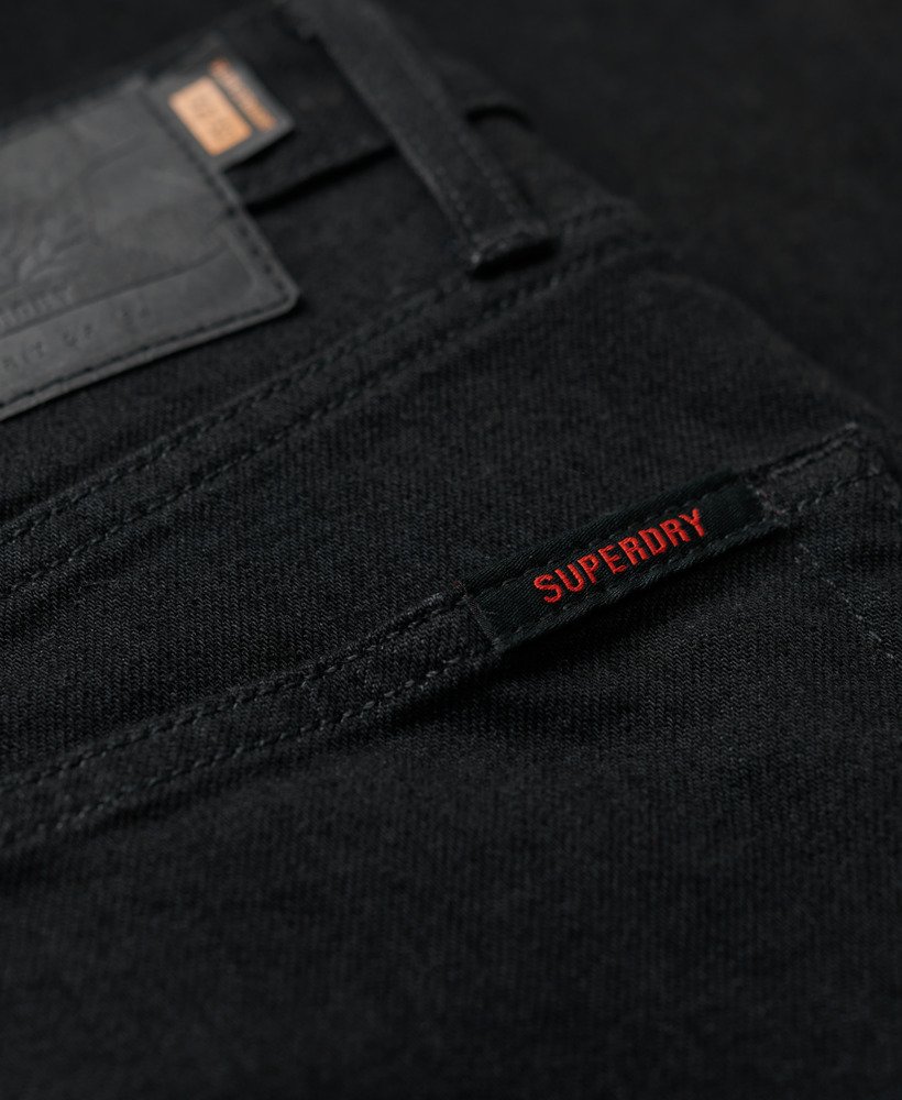 calça jeans vintage slim reta na cor preta lavada venom.
