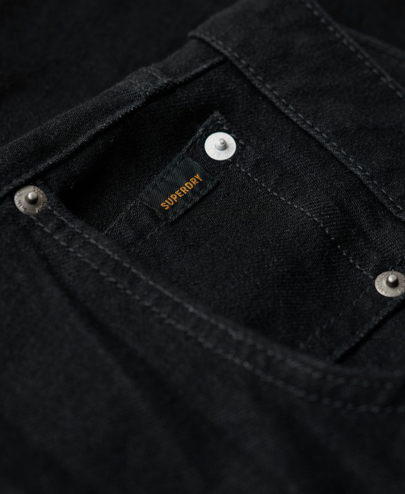 calça jeans vintage slim reta na cor preta lavada venom.