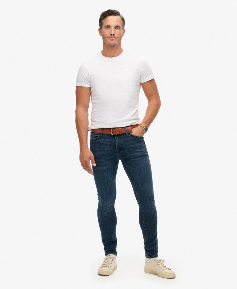 calça jeans skinny vintage na cor vanderbilt ink com efeito desgastado.