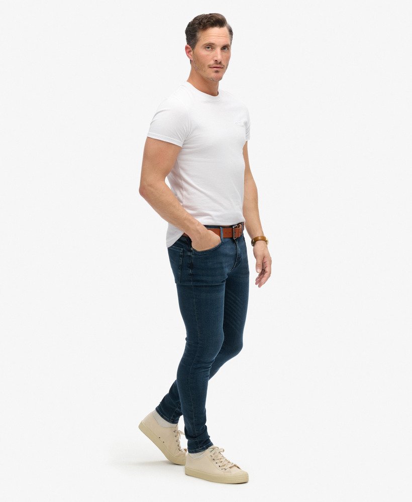 calça jeans skinny vintage na cor vanderbilt ink com efeito desgastado.