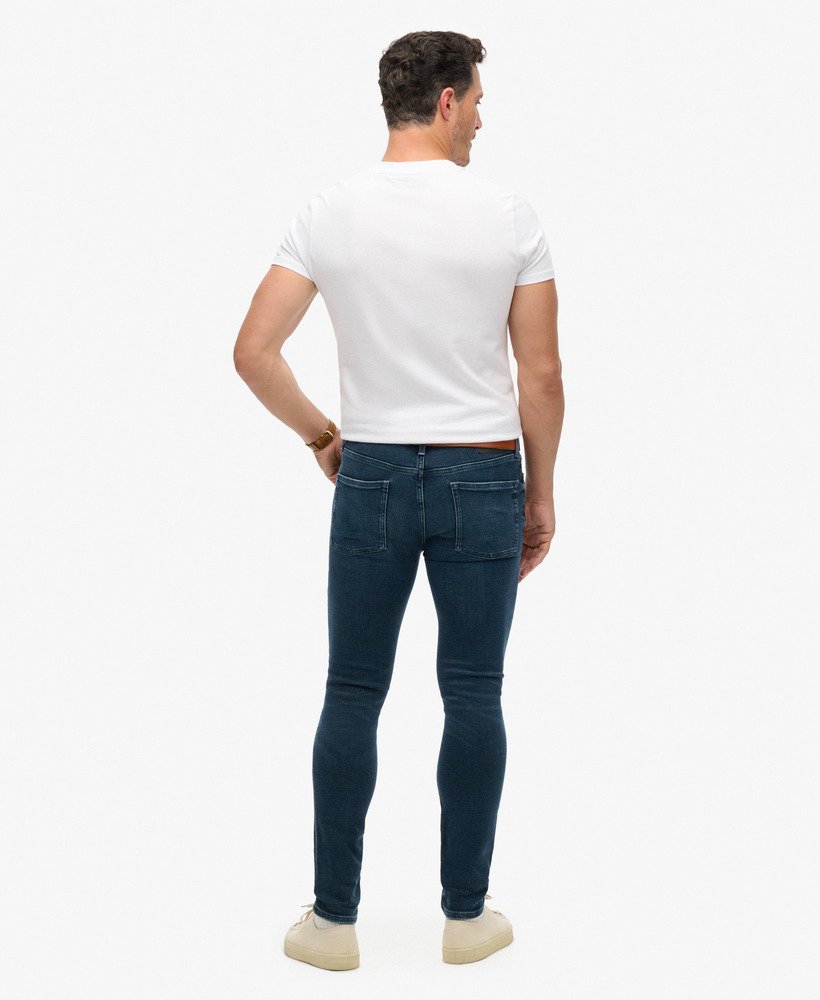 calça jeans skinny vintage na cor vanderbilt ink com efeito desgastado.