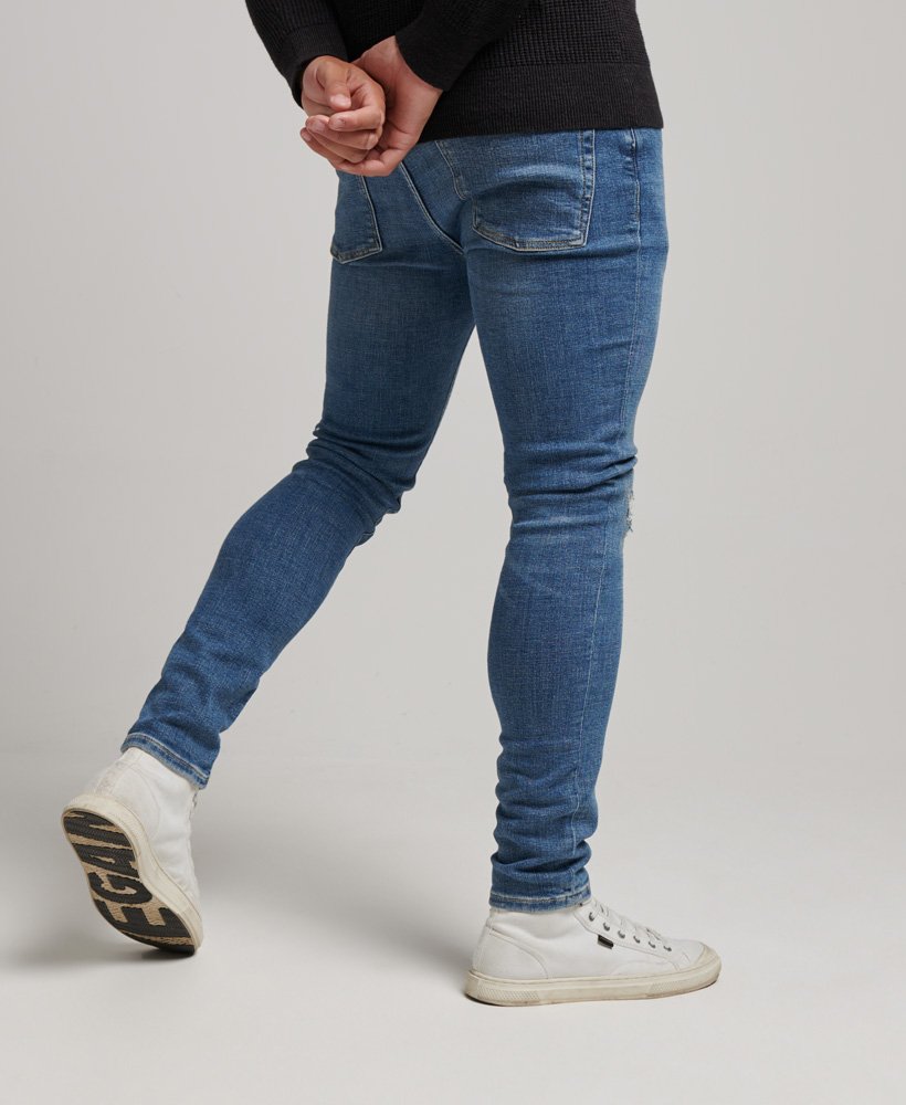 calça jeans skinny vintage stanton azul brilhante rasgada