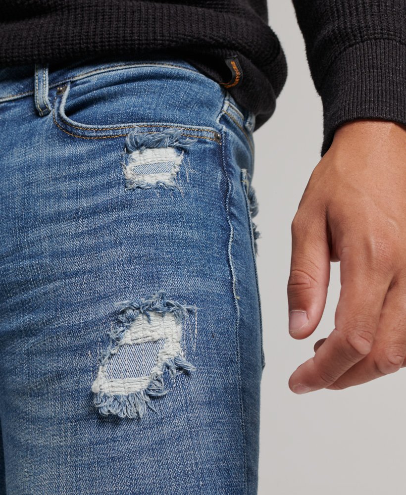 calça jeans skinny vintage stanton azul brilhante rasgada