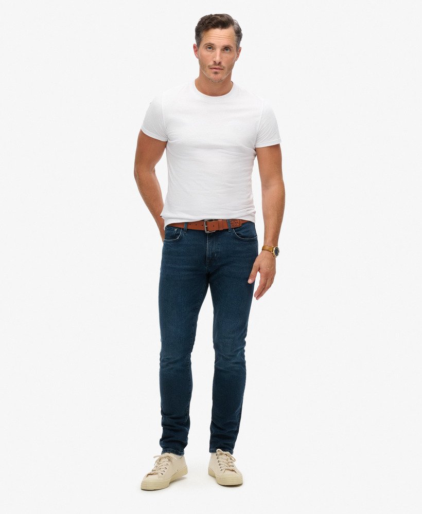 calça jeans vintage slim na cor vanderbilt ink com efeito desgastado.