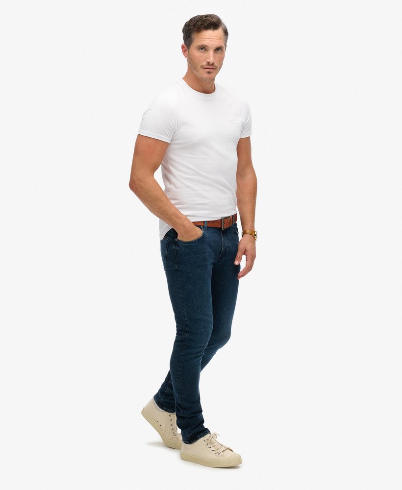 calça jeans vintage slim na cor vanderbilt ink com efeito desgastado.