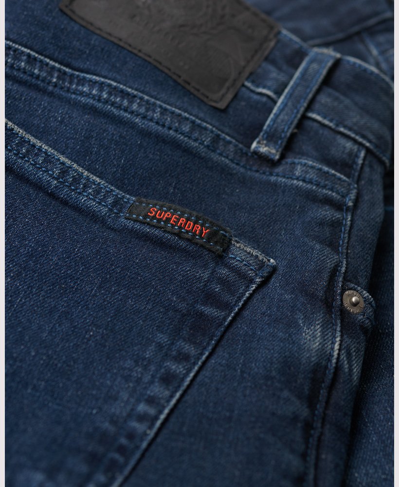 calça jeans vintage slim na cor vanderbilt ink com efeito desgastado.
