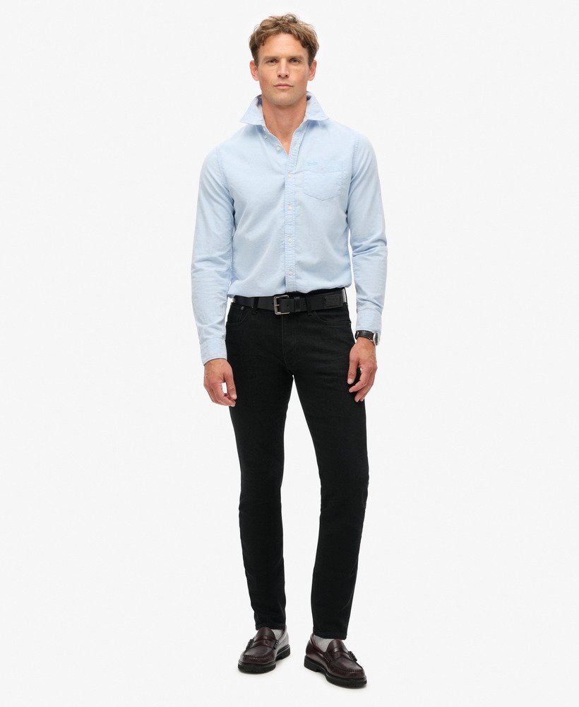 calça jeans vintage slim na cor preta lavada venom.
