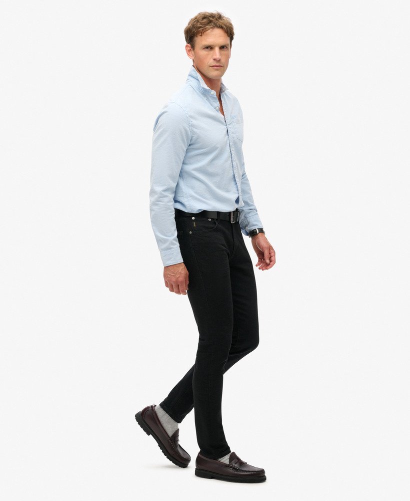 calça jeans vintage slim na cor preta lavada venom.