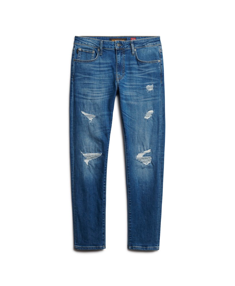 calça jeans vintage slim na cor stanton azul brilhante com rasgos.