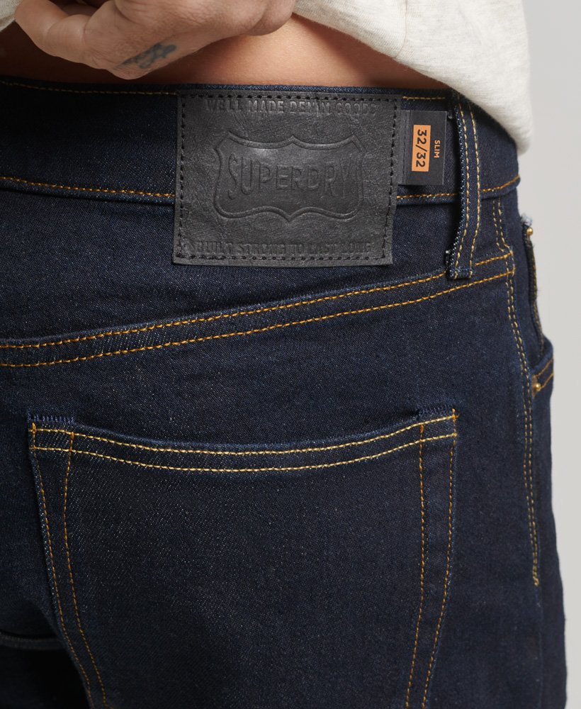 the merchant store - calça jeans slim orgânica em sarja azul escura