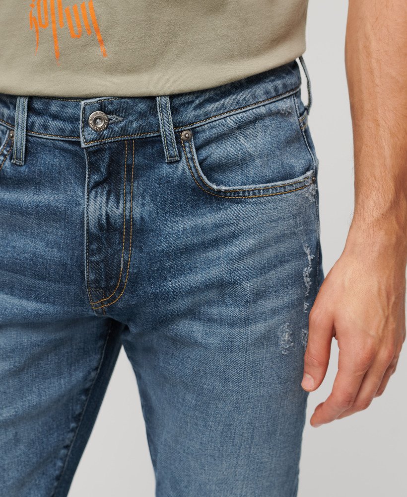 calça jeans vintage slim na cor azul folsom médio