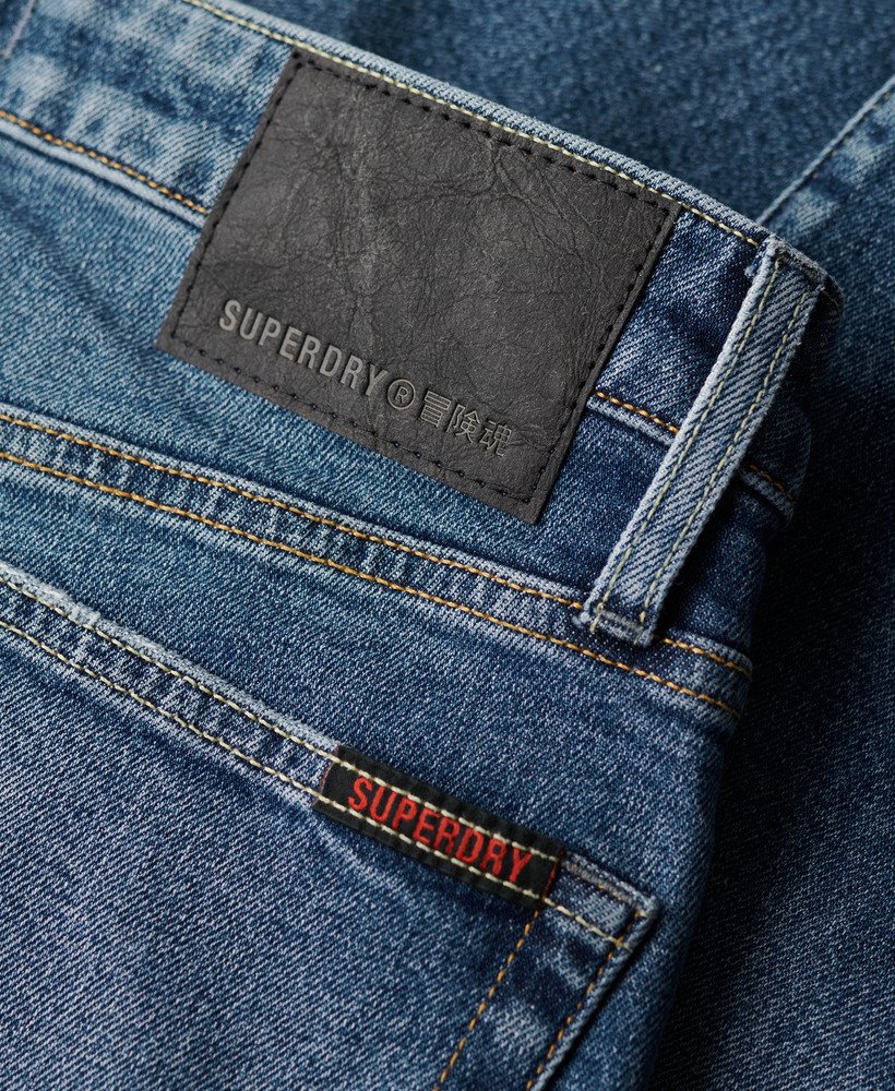 calça jeans vintage slim na cor azul folsom médio