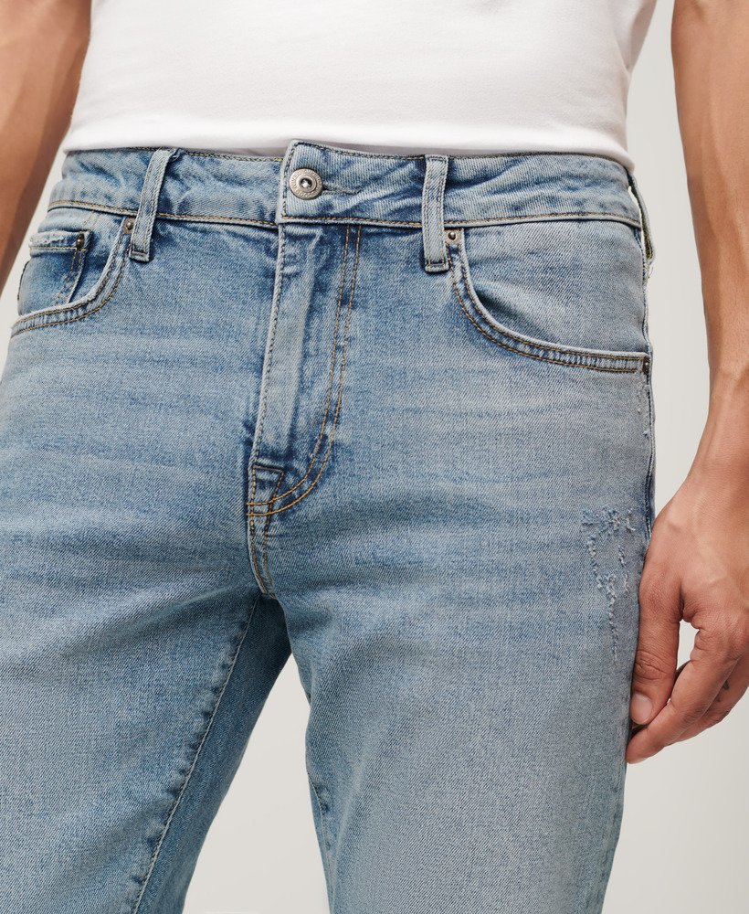 calça jeans vintage slim na cor azul shotwell