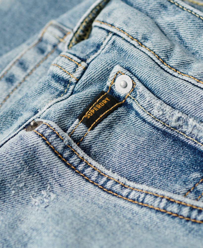 calça jeans vintage slim na cor azul shotwell