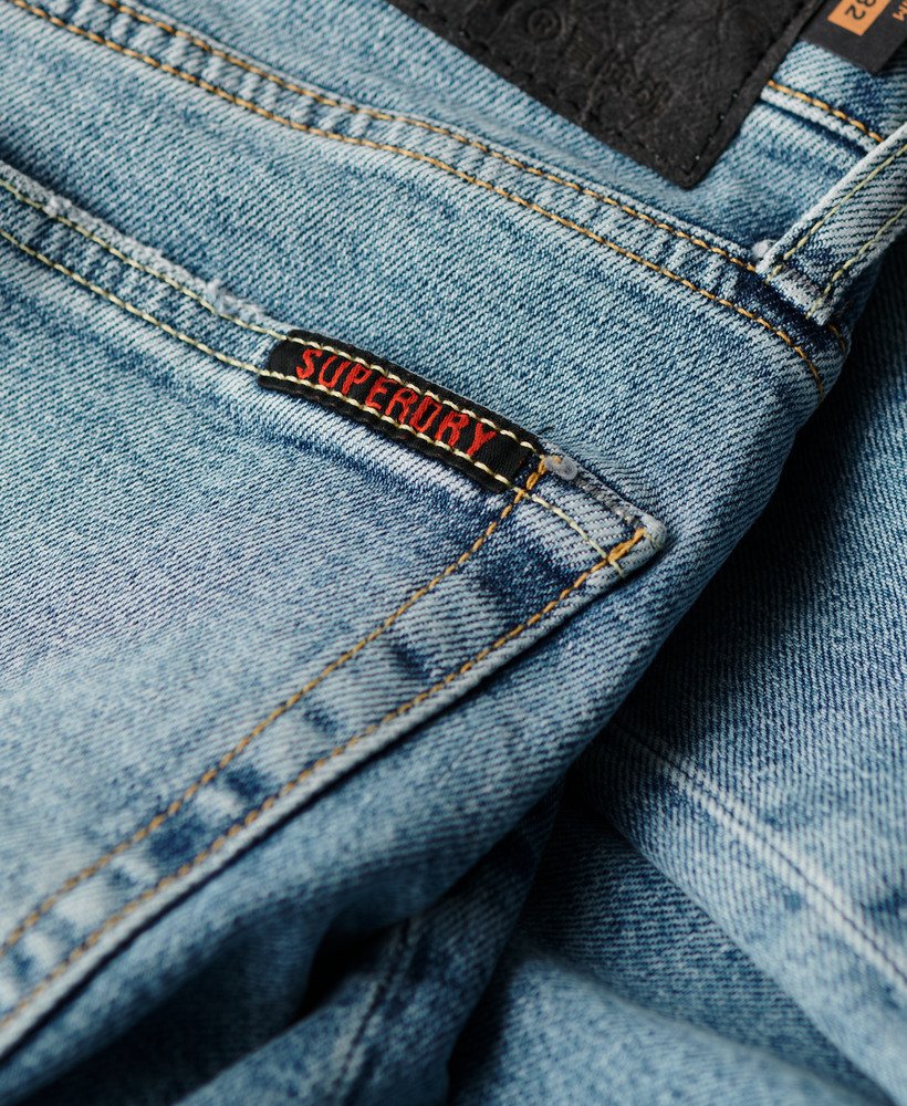calça jeans vintage slim na cor azul shotwell